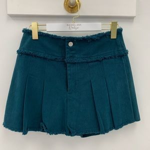 Pleated skort with front buttons and zipper, back pockets